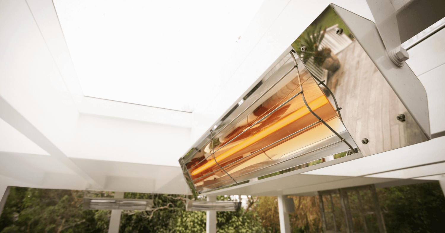 Closeup image of an illuminated Kelray Heater installed on a covered patio